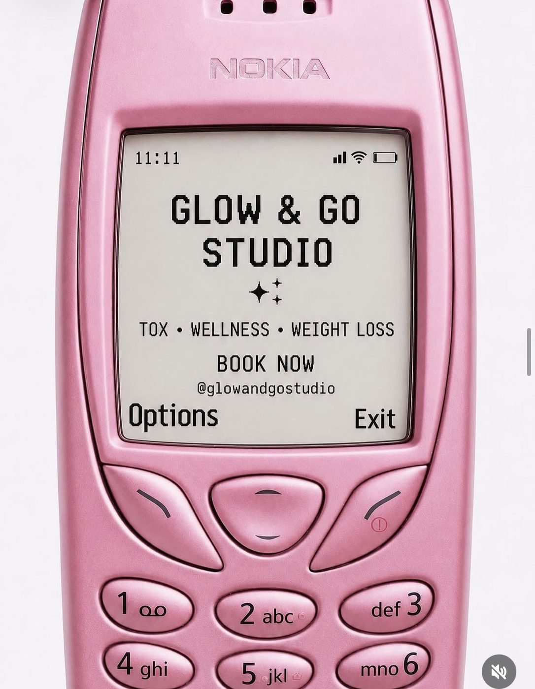 Glow & Go Studio branded graphic styled as a retro pink mobile phone